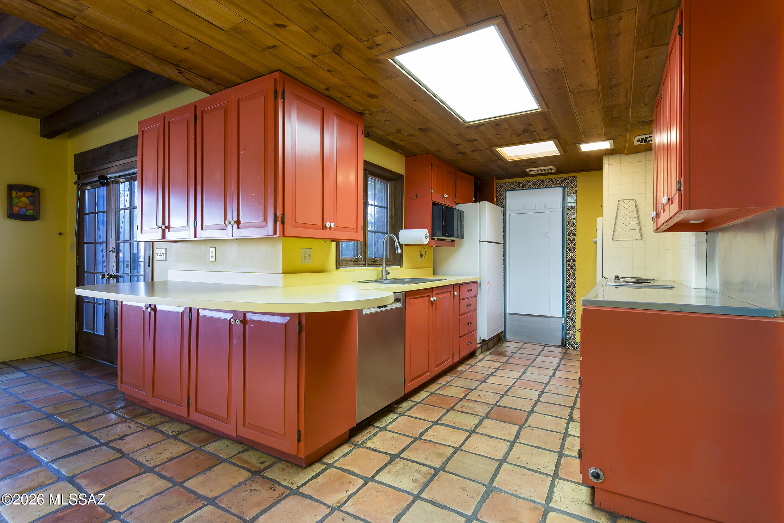 4130 East River Road Tucson, AZ 85718 - Photo 11 of 46 a kitchen with stainless steel appliances granite countertop a stove a sink and a refrigerator