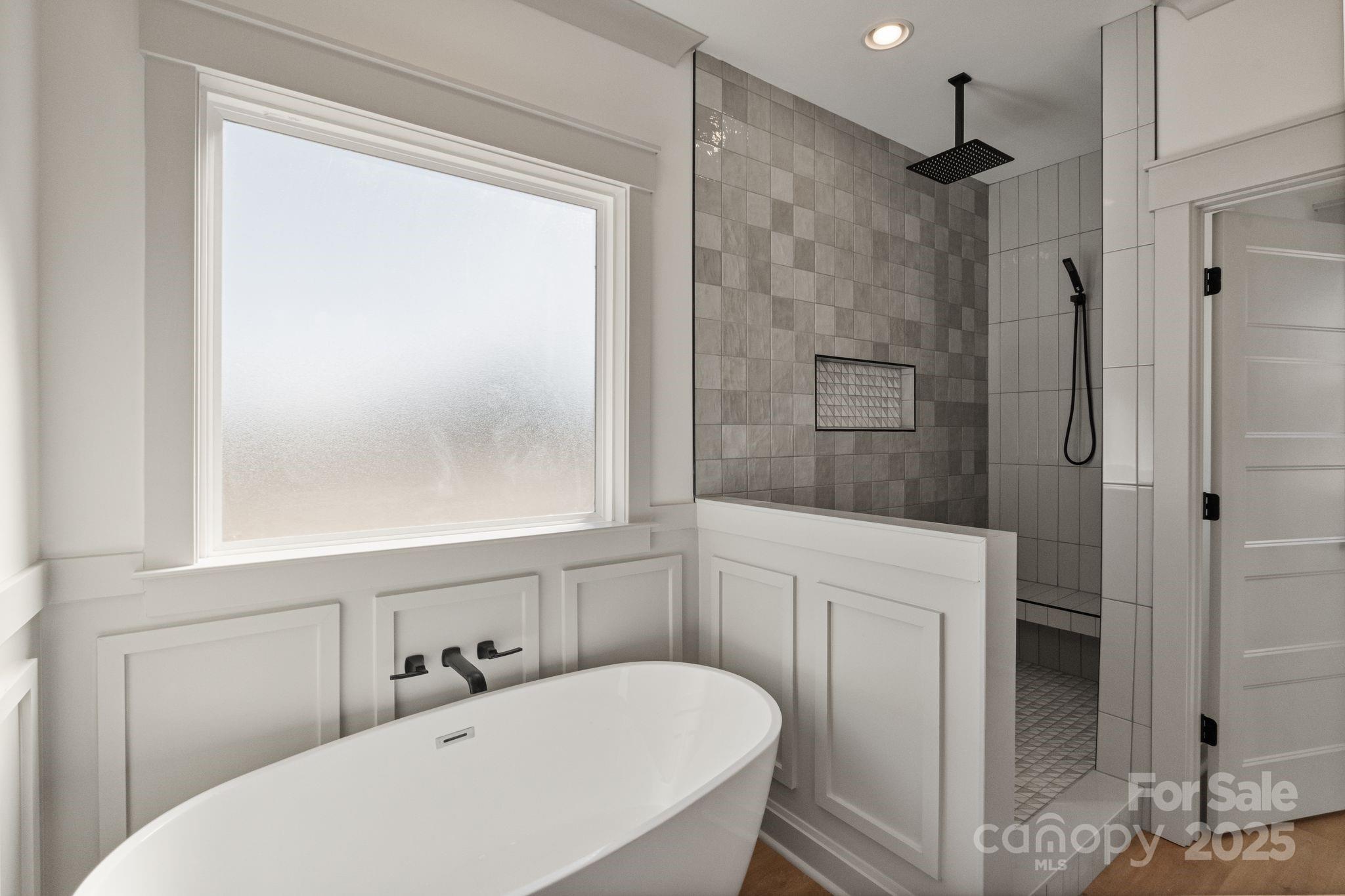 1050 Tom Joye Road Clover, SC 29710 - Photo 18 of 29 a bathroom with a sink a mirror and a shower