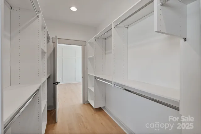 a view of an empty walk in closet