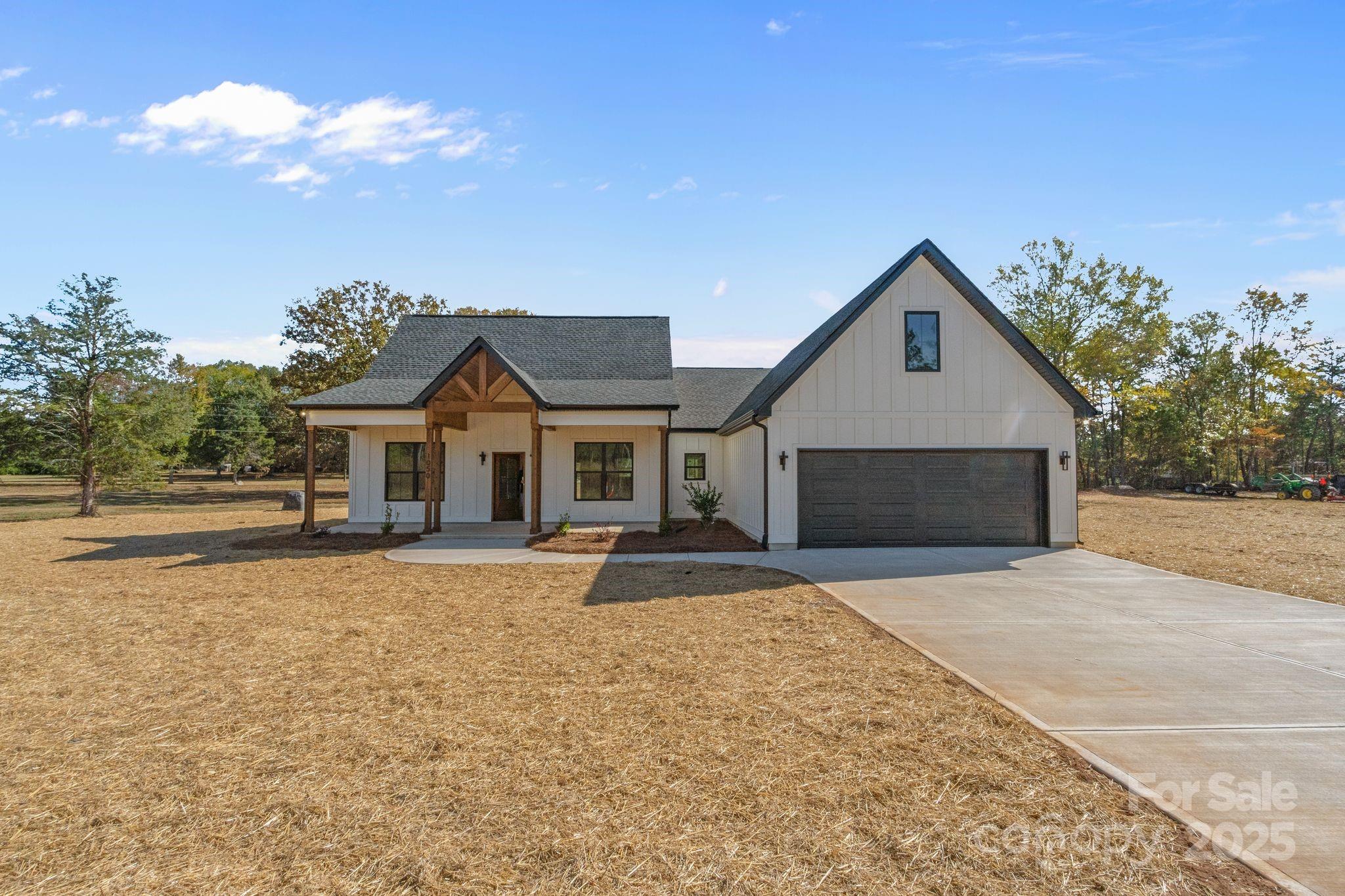 1050 Tom Joye Road Clover, SC 29710 - Photo 27 of 29 a front view of a house with a yard and garage
