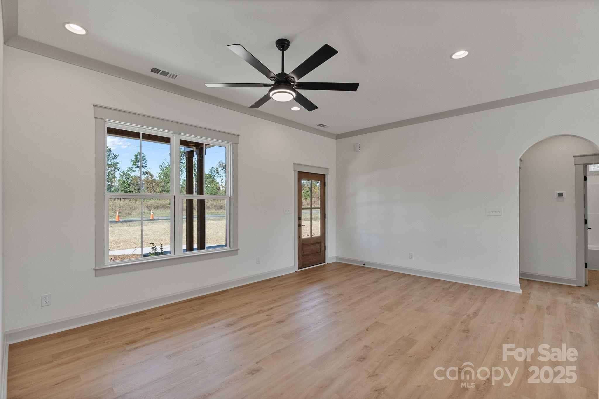 1050 Tom Joye Road Clover, SC 29710 - Photo 4 of 29 a view of an empty room with wooden floor and a window
