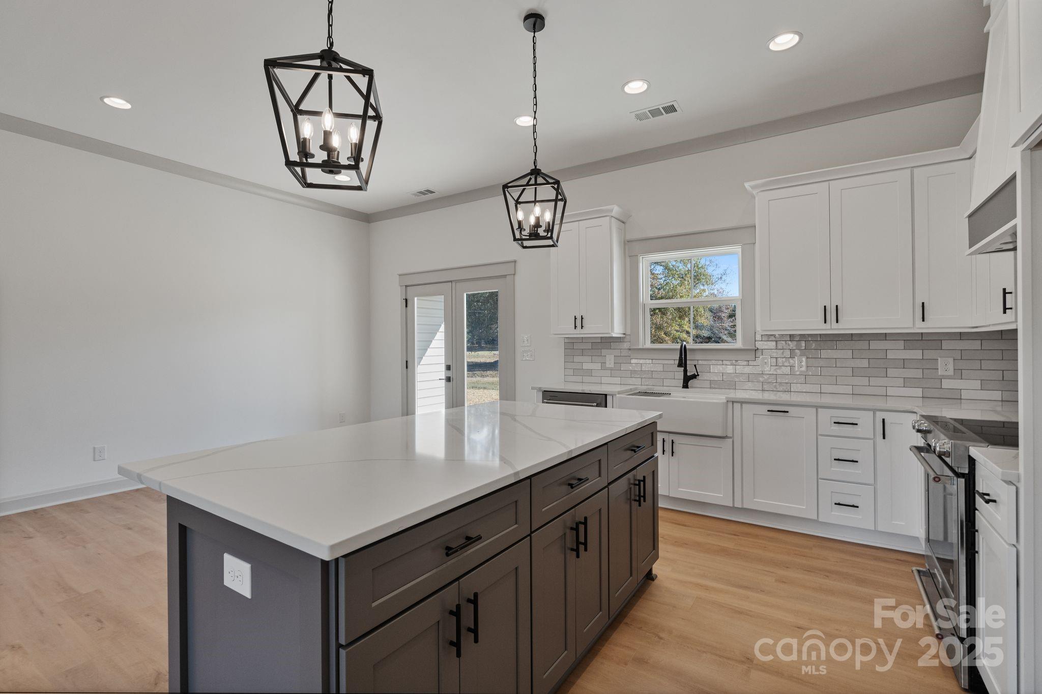 1050 Tom Joye Road Clover, SC 29710 - Photo 6 of 29 a kitchen with sink cabinets and window