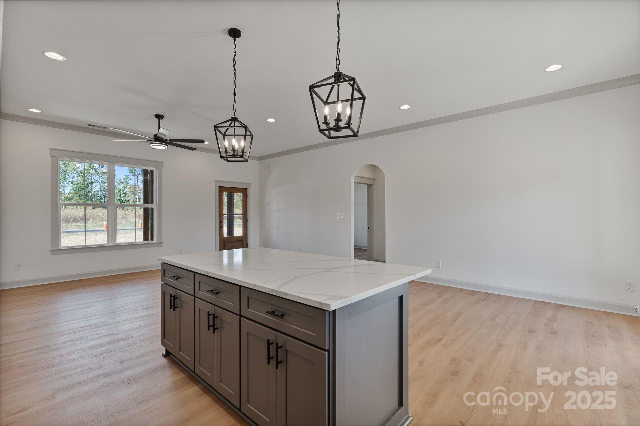 1050 Tom Joye Road Clover, SC 29710 - Photo 9 of 29 a view of a center island and wooden floor