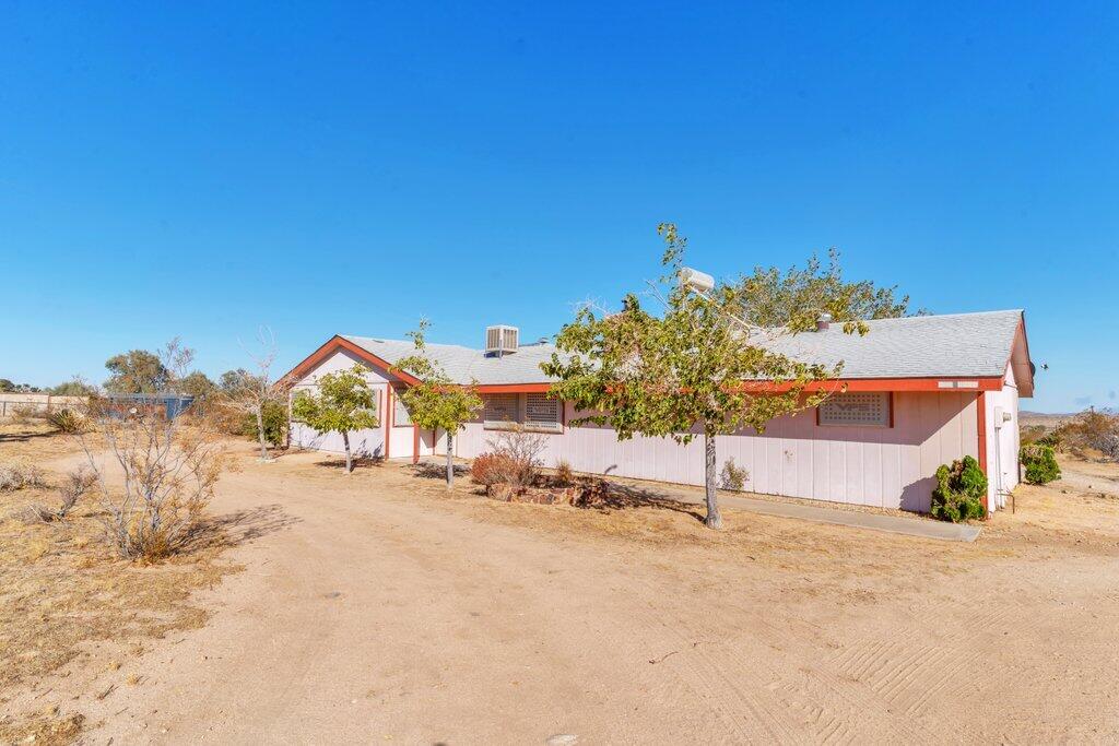 925 Inca Trail Yucca Valley, CA 92284 - Photo 1 of 31 a view of a house with a street