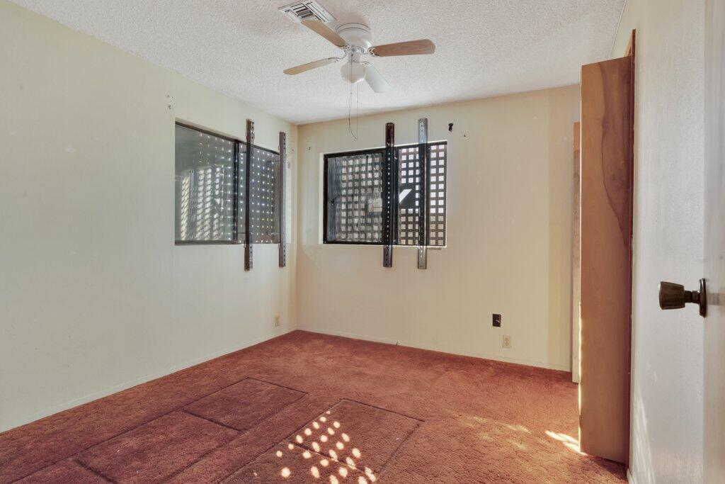 925 Inca Trail Yucca Valley, CA 92284 - Photo 12 of 31 a view of an empty room with a window