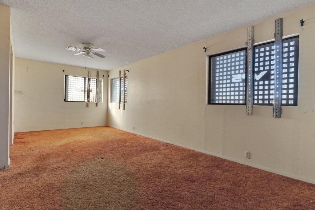 925 Inca Trail Yucca Valley, CA 92284 - Photo 15 of 31 a view of an empty room with a window