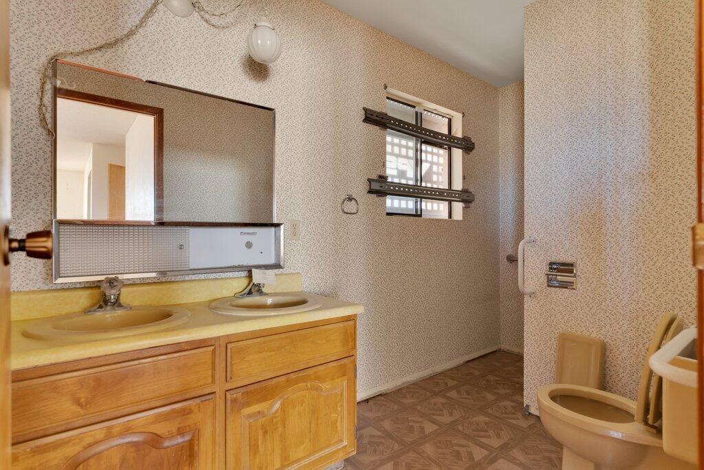 925 Inca Trail Yucca Valley, CA 92284 - Photo 19 of 31 a bathroom with a sink and a mirror