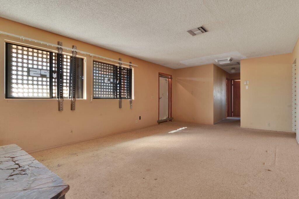 925 Inca Trail Yucca Valley, CA 92284 - Photo 10 of 31 a view of an empty room with a window