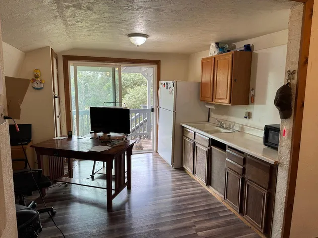 a bathroom with a sink toilet and mirror