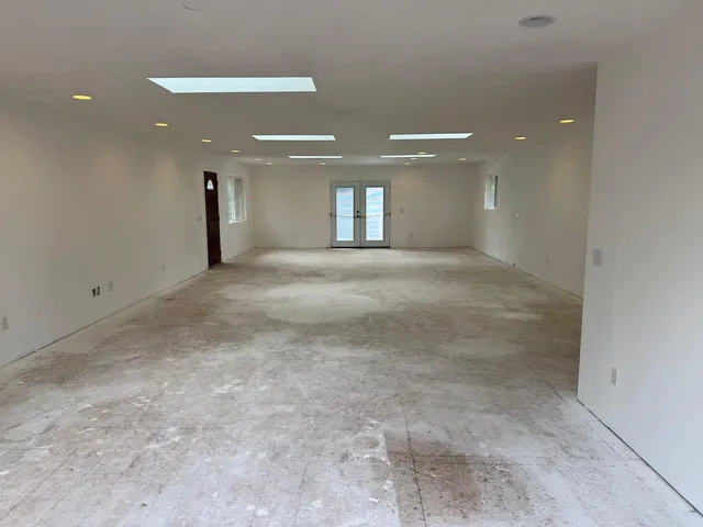 a kitchen with sink cabinets and refrigerator