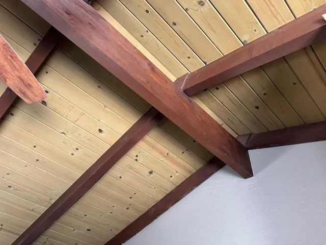 a room with furniture a flat screen tv and a window