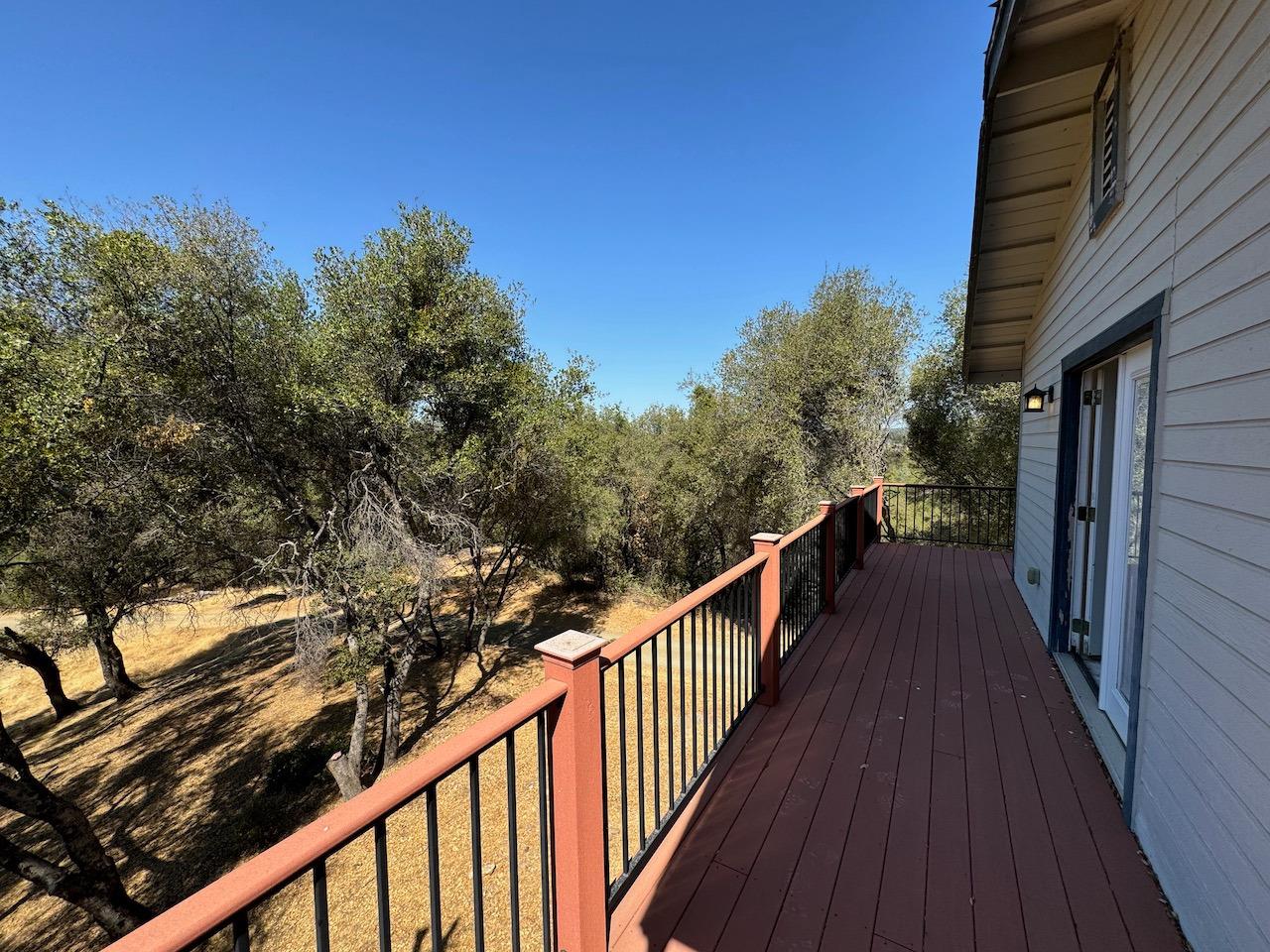 14950 Clinton Road Jackson, CA 95642 - Photo 44 of 50 a view of a balcony with wooden floor and fence