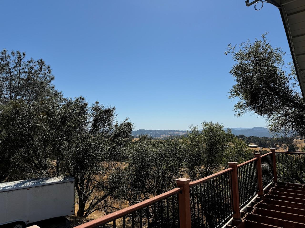 14950 Clinton Road Jackson, CA 95642 - Photo 10 of 50 a view of a balcony with wooden fence and floor
