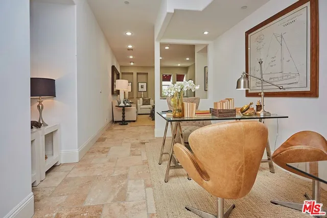 a lobby with furniture and a mirror