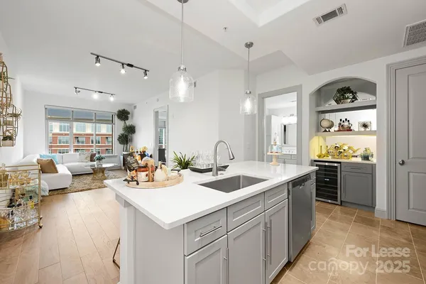 a kitchen with a sink stove and cabinets