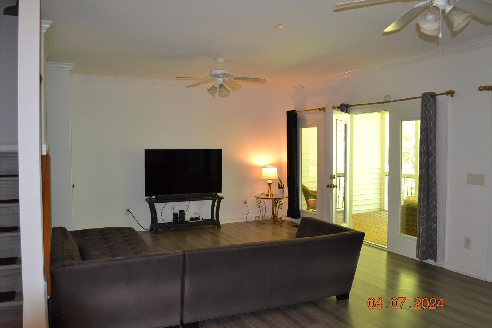 4506 Mistiflower Drive Raleigh, NC 27606 - Photo 8 of 27 a living room with furniture and a flat screen tv