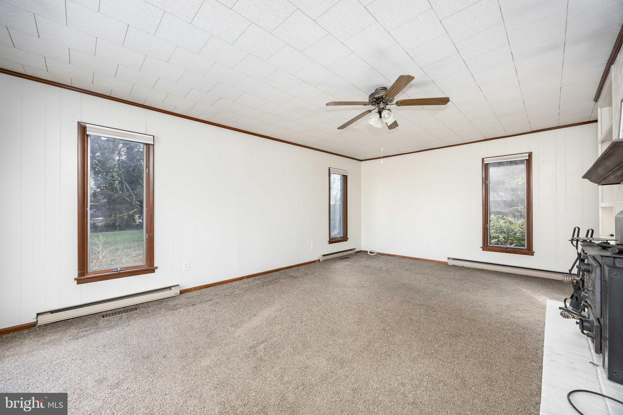 310 Zion Road Salisbury, MD 21804 - Photo 14 of 40 an empty room with windows and fan