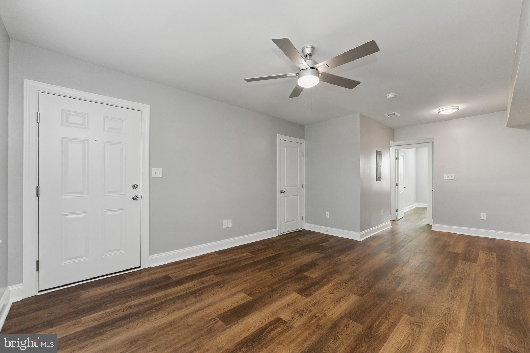 2021 E Street Northeast, Unit 2 Washington, DC 20002 - Photo 3 of 14 a view of an empty room with wooden floor and a ceiling fan