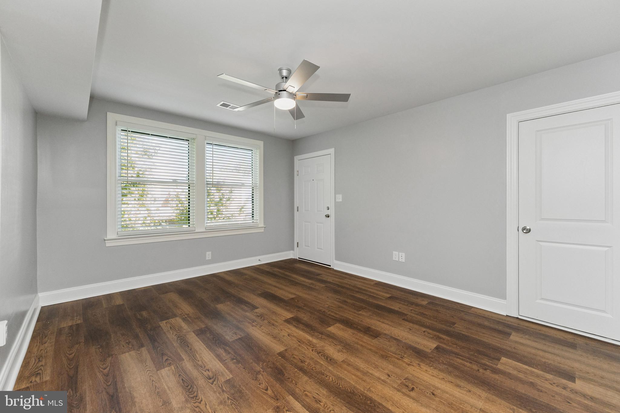 2021 E Street Northeast, Unit 2 Washington, DC 20002 - Photo 4 of 14 a view of an empty room with wooden floor and a window