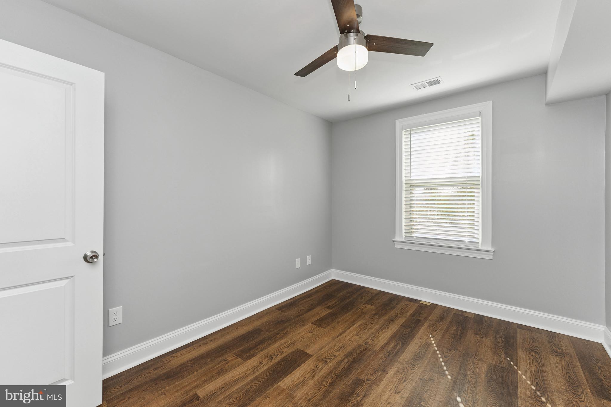 2021 E Street Northeast, Unit 2 Washington, DC 20002 - Photo 10 of 14 a view of empty room with wooden floor and fan