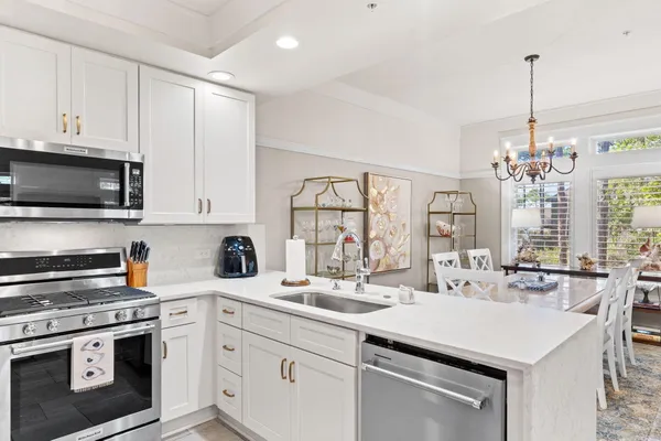 a balcony with wooden floor and outdoor seating