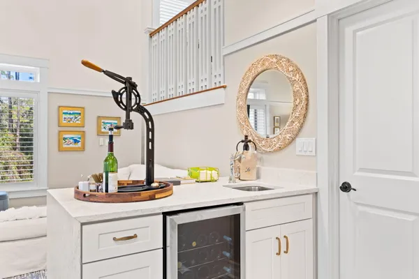 a bedroom with a large bed and a night stand