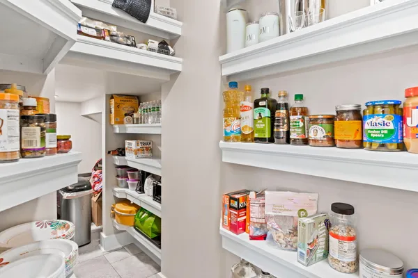 a bedroom with a bed and a television