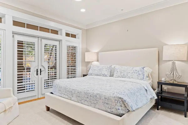 a bedroom with a large bed and a couch