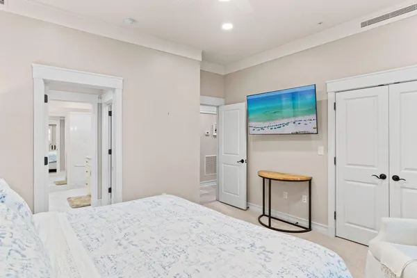 a dining room with furniture and a floor to ceiling window