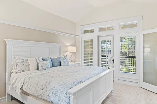 a bedroom with a bed and cabinets