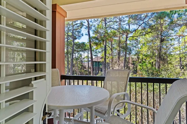 a bedroom with two beds and a large window