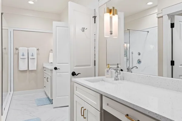 a view of lake with a large tree