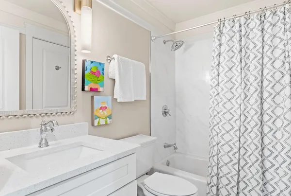 a view of a lake with couches and chairs