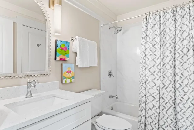 a view of a lake with couches and chairs