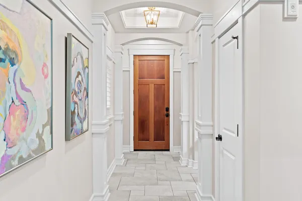 a living room with furniture and kitchen view