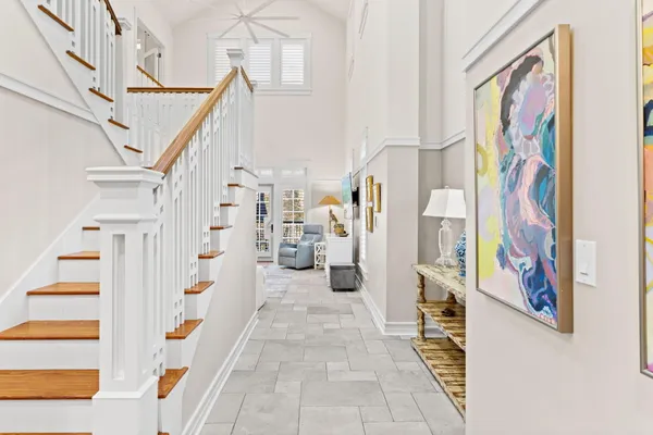 a living room with furniture and painting on the wall