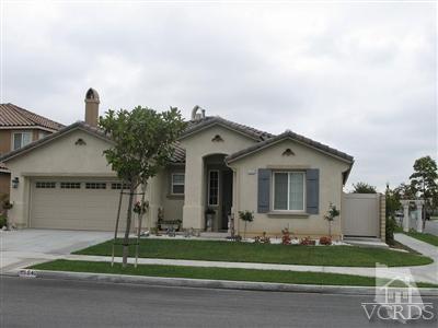 640 Riviera Court Oxnard, CA 93035 - Photo 1 of 12 a view of a white house next to a yard and a road