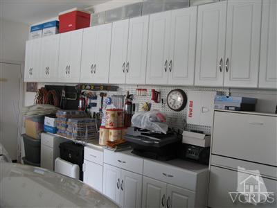 640 Riviera Court Oxnard, CA 93035 - Photo 11 of 12 a kitchen with stainless steel appliances granite countertop a sink a stove and cabinets