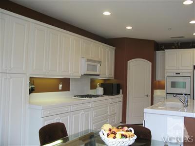 640 Riviera Court Oxnard, CA 93035 - Photo 5 of 12 a kitchen with stainless steel appliances a refrigerator sink and cabinets