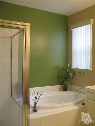 640 Riviera Court Oxnard, CA 93035 - Photo 9 of 12 a bathroom with a bathtub and a shower