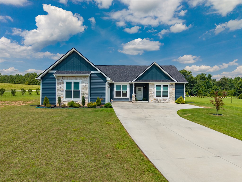 422 Mountain View Church Road Six Mile, SC 29682 - Photo 1 of 40 A graceful home with a welcoming driveway offers serene living amidst natural beauty.