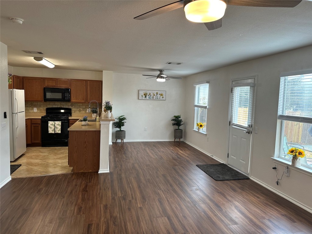 5621 Silver Screen Drive Austin, TX 78747 - Photo 1 of 1 a view of kitchen with cabinets and wooden floor