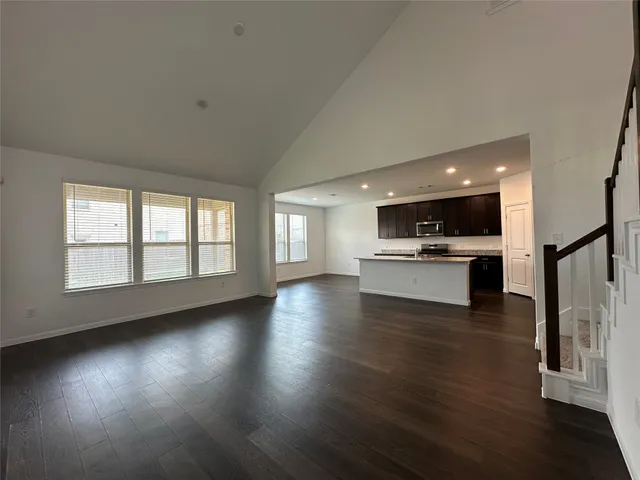 a view of kitchen with cabinets and wooden floor