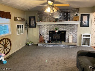 10682 Ravenswood Road Ravenswood, WV 26164 - Photo 12 of 46 Living room with ceiling fan, carpet floors, and a fireplace