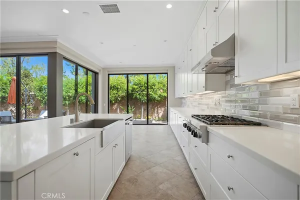 a kitchen with white cabinets