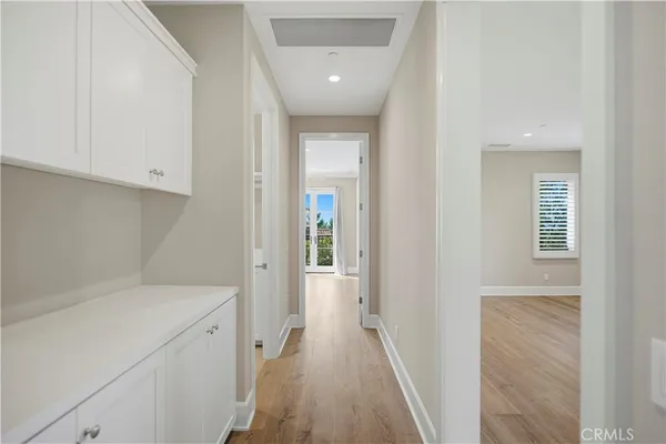 a view of a kitchen with wooden floor