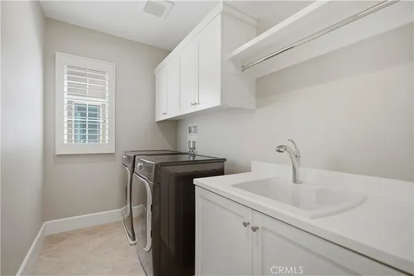 a view of a patio with a table and chairs