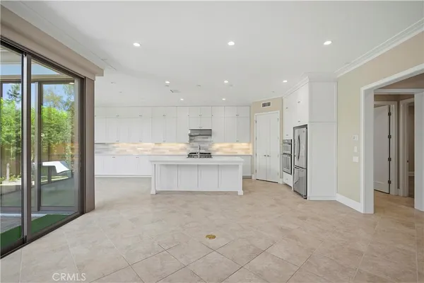 a kitchen with stainless steel appliances granite countertop a sink and cabinets