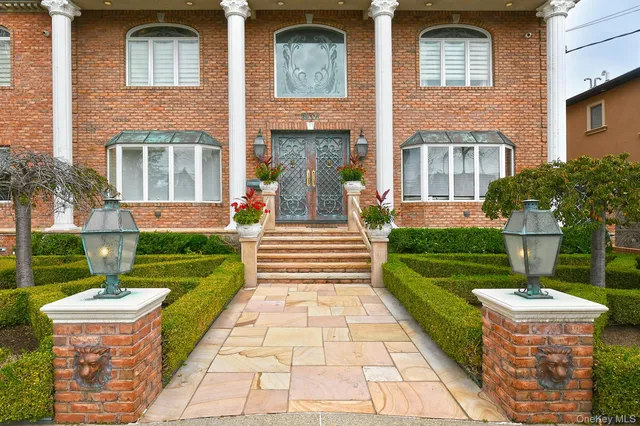 a front view of a house with a yard table and chairs