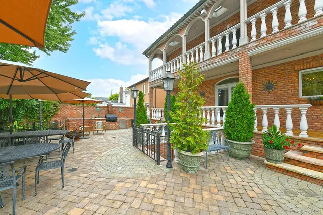 a view of a porch with furniture and yard